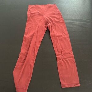 Women’s Lululemon size 0, 23” inch red leggings.